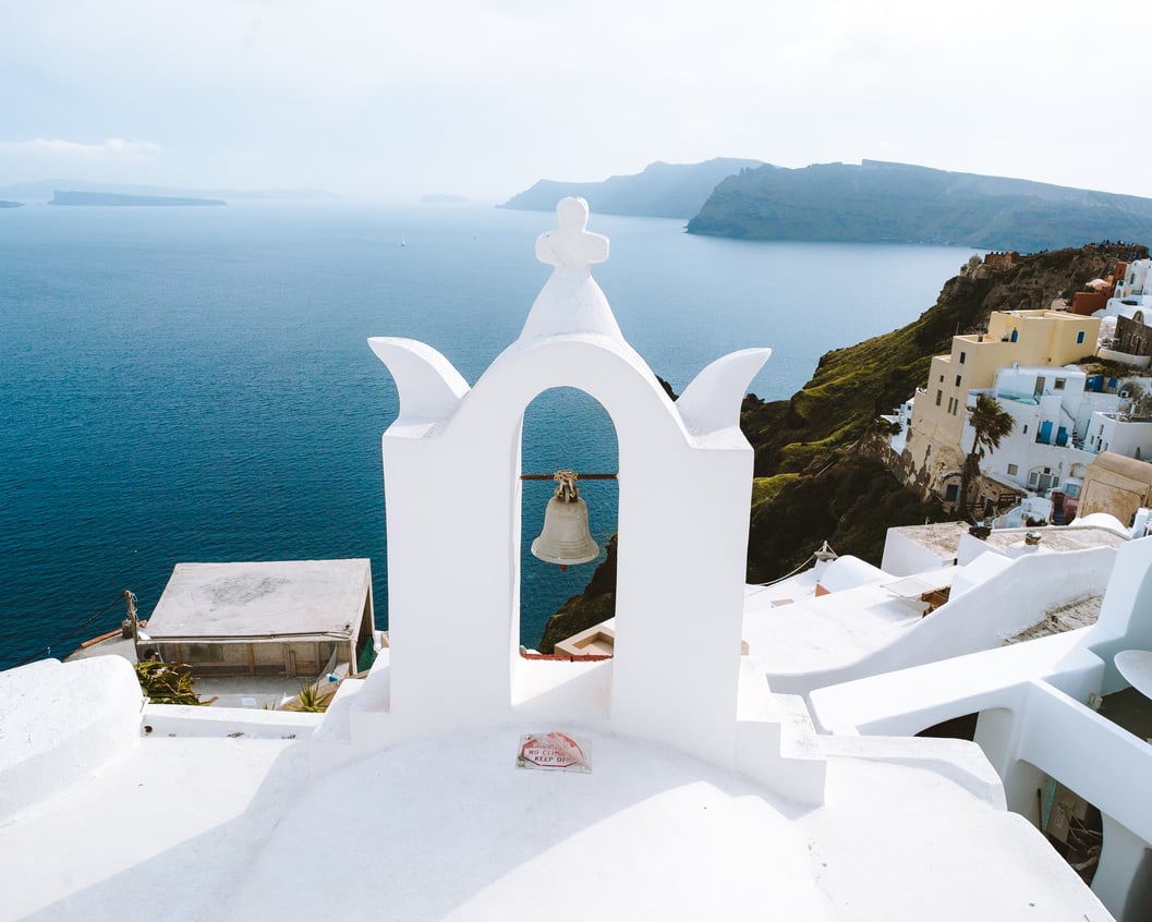 White Concrete Church Near Body of Water